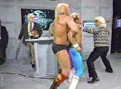 flair (and his manly sweater) doles out the punishment